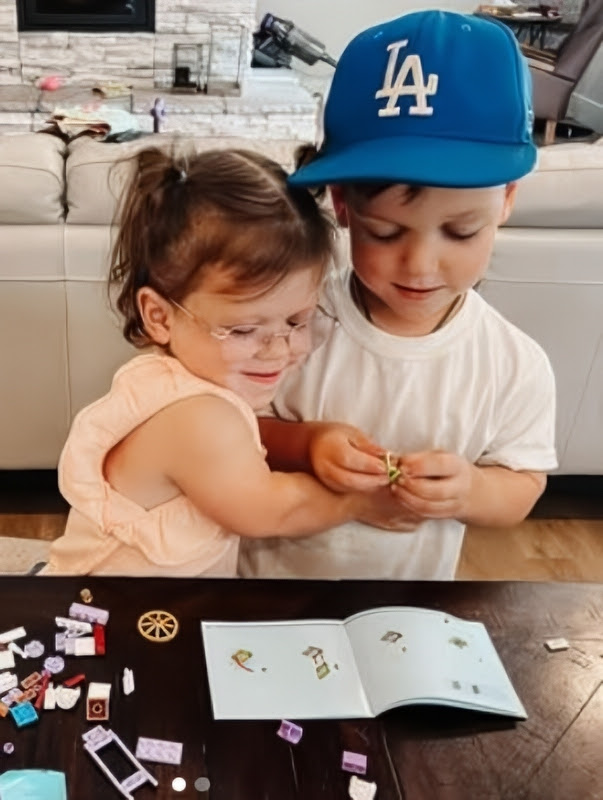 Tori shared this cute photo of her daughter loving her brother Jackson in 2024 - Instagram